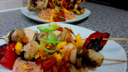 Chicken Kebab on a bed of spicy Rice noodles